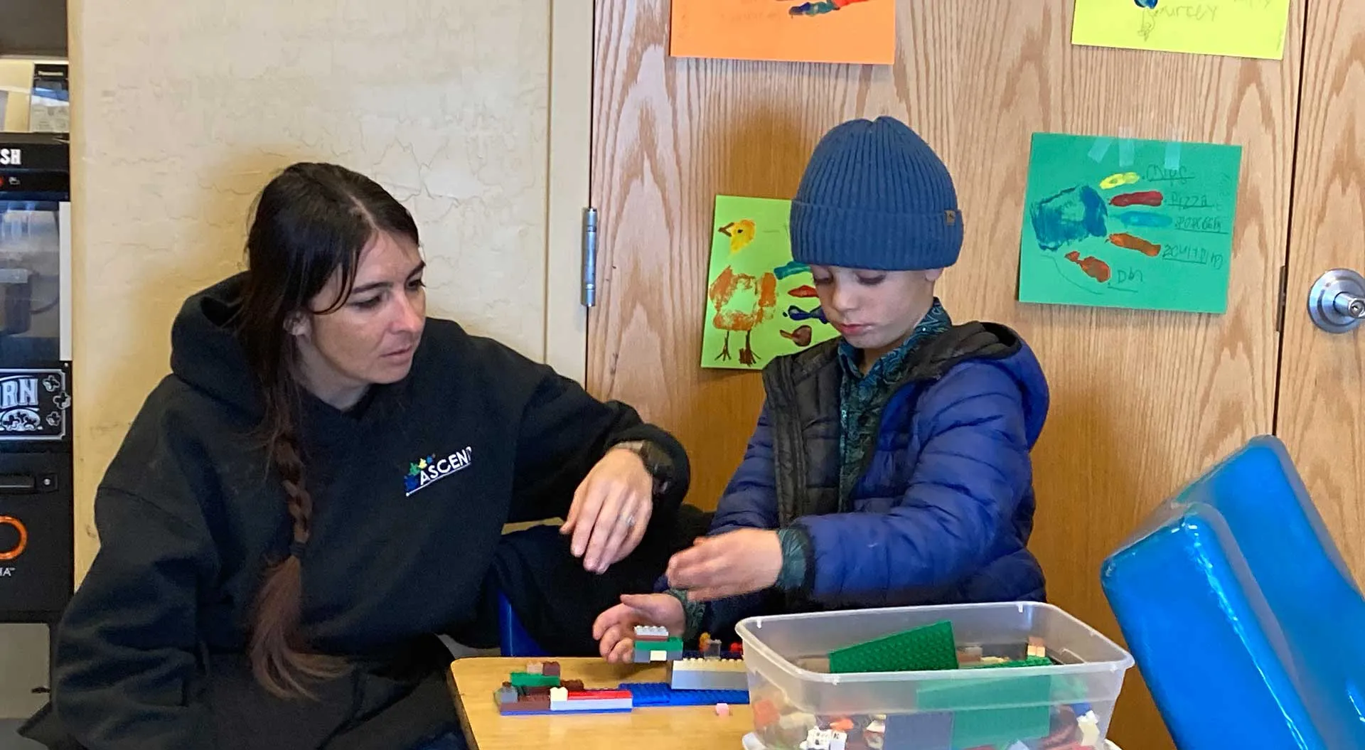 Teacher building with a student during hands-on learning at ASCEND